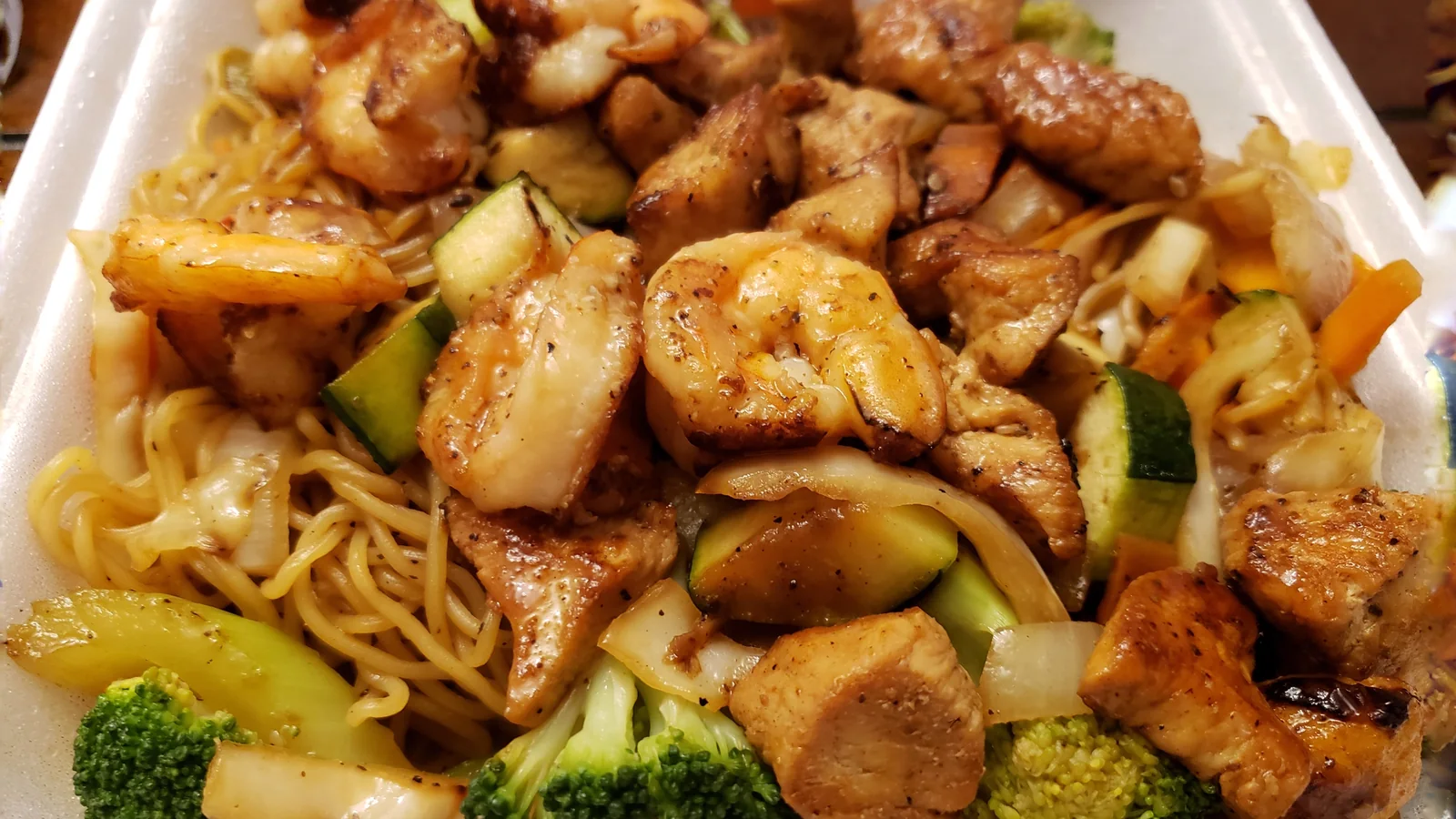 Noodles, shrimp, chicken, and vegetables prepared at Akashi