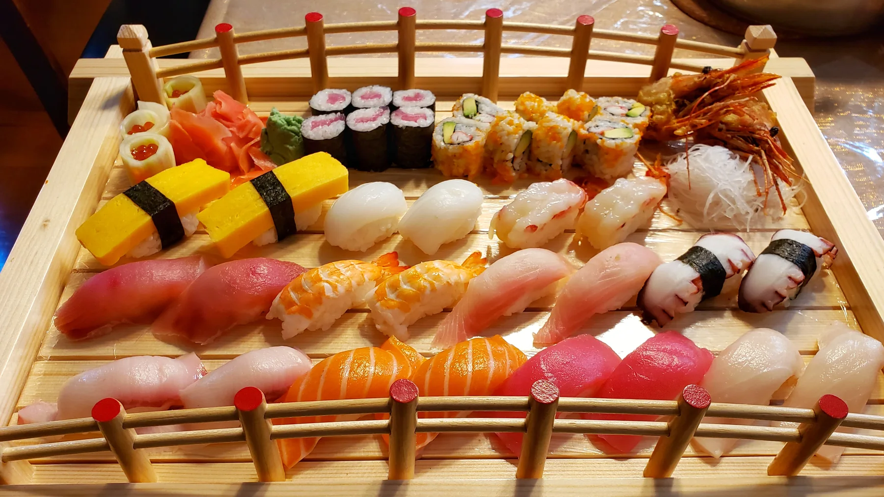 Akashi sushi and sashimi served in a wooden boat